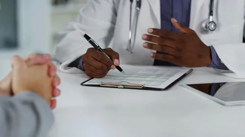 Doctor holds documents in hand checkup or diagnosis Doctors writing information Stock-Footage 336588406