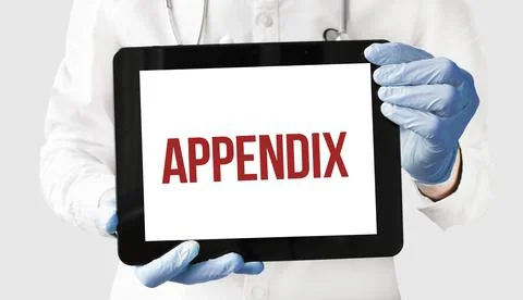 Doctor in holds a tablet with text appendix Foto stock