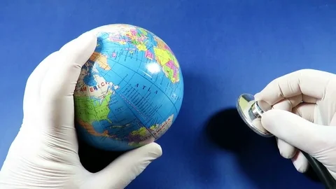 Doctor inspecting the globe with a stethoscope Stock-Footage 71452761