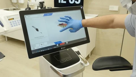 Doctor inspects at  3d model of x-rays of the patient's jaw and teeth Stock Footage 245487975