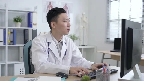 Doctor just solving a problem on the computer Video stock 145179649