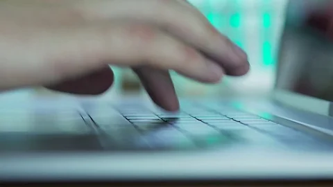 The doctor in the lab typing on notebook report on his research Stock Footage 83000064