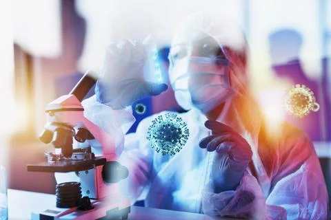 Doctor in the laboratory analyzes samples under a microscope. Pharmaceutica.. 写真素材