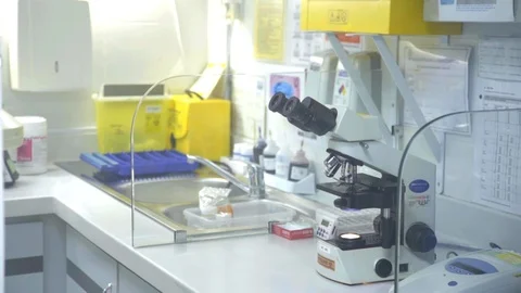 A Doctor In The Laboratory Looks Through The Microscope Video stock 97841448