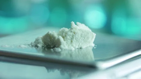 The doctor in the laboratory using a spatula to mix powder pours on electronic s Stock Footage 83000194