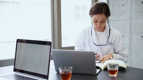 Doctor lady working on her computer Stock Footage 147600003