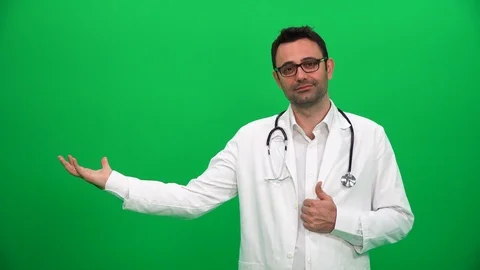 Doctor Lifting Or Presenting Something on Green Screen. Right Side. Stock Footage 88652179