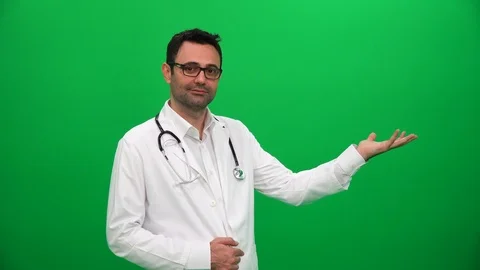 Doctor Lifting Or Presenting Something on Green Screen. Left Side. Stock Footage 88652201