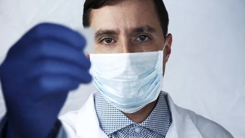 Doctor look close-up of the hands of a lab technician on a glass plate Stock Footage 94997041