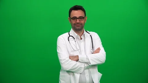 Doctor Looking at Camera on Green Background Stockbeeldmateriaal 88652303