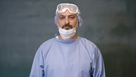 The doctor is looking at the camera seriously. Stock Footage 132140030