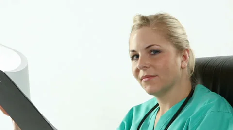 Doctor Looking At Clipboard 스톡 동영상 35140238