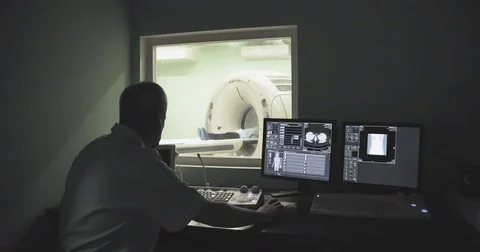 Doctor looking computer screen patient CT MRI 4k video. Tomography monitor Stock Footage 69795170