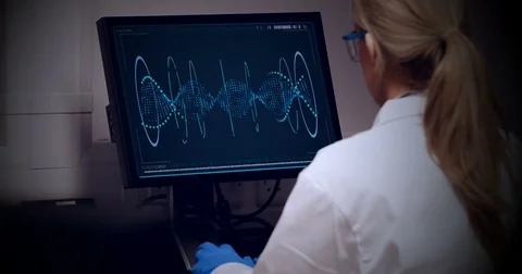 Doctor looking dna molecule on computer Stock Footage 76676642