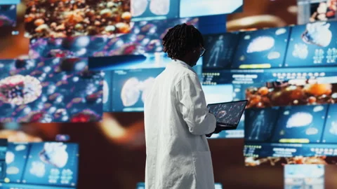 Doctor looking at genomes on notebook screen, comparing infection models Stock Footage 318934273