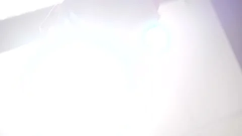 Doctor Looking Over Patient with Loop Glasses Stock Footage 148499086