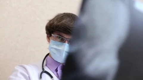Doctor is looking an x-ray Stock Footage 80254482