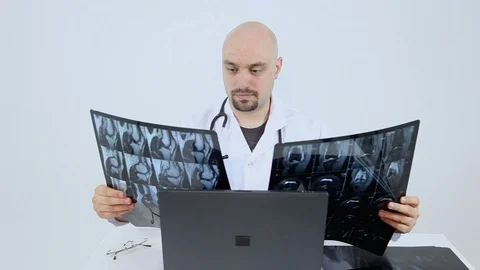 Doctor Looking At XRays 库存影片 118233803
