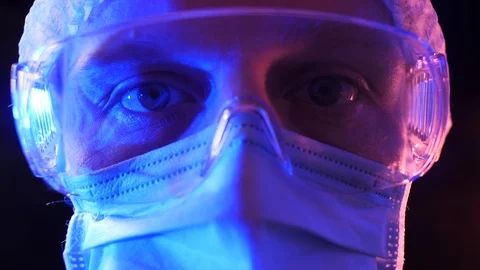 Doctor looks at the camera with dramatic light. Stock Footage 127302897