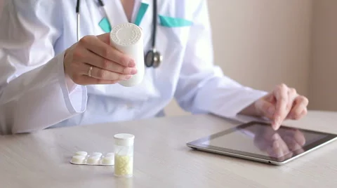 Doctor Looks at the Description of the Drug Stock Footage