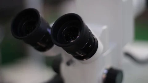 Doctor Looks Into a Microscope Stock Footage 70403211