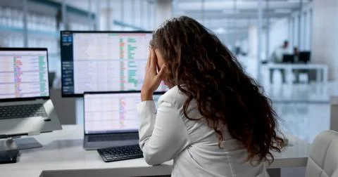 Doctor Looks Upset While Using Computer To Check Patient Data. Stock Photos