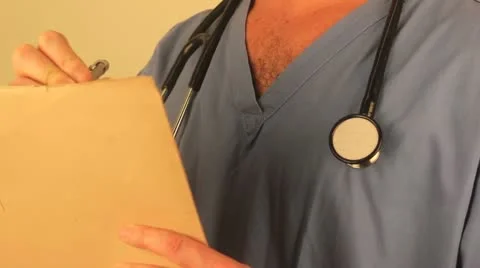 Doctor makes a note Stock Footage 21927285