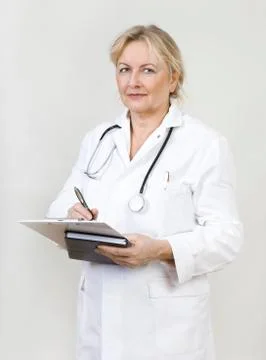 Doctor makes note Stock Photos