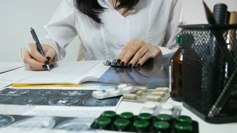 The doctor makes notes about the preparations Stock-Footage 87477363