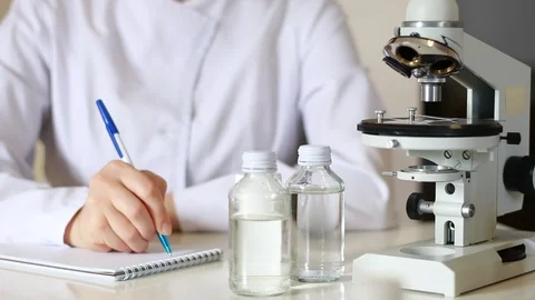 Doctor makes notes in the laboratory. Stock Footage 129888641