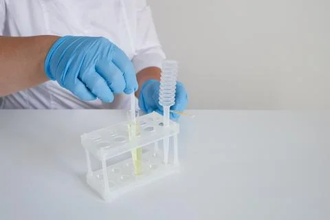 Doctor making express urinalysis using strips in clinical laboratory Stock Photos