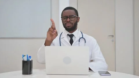 Doctor Making a No Gesture During Looking at Camera Stock Footage 310167487
