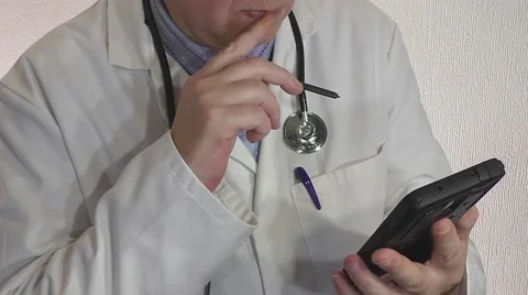 Doctor making notes with Stethoscope Stock Footage 55213015