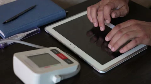 The doctor making notes on a tablet Stock Footage 68423040