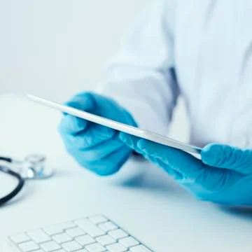 Doctor man using a digital tablet 写真素材