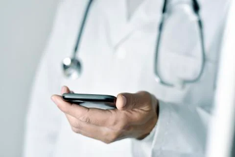 Doctor man using a smartphone Foto stock