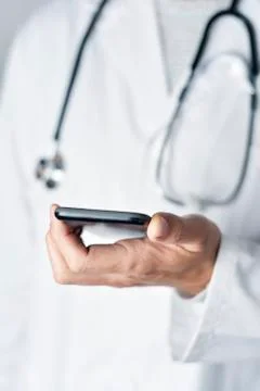 Doctor man using a smartphone Foto stock