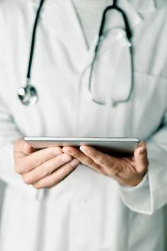 Doctor man using a tablet computer 스톡 사진