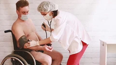 The doctor measures the pressure Stock Footage 155484952
