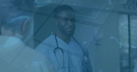 Doctor nodding speaking in corridor while colleague speaking to discuss data Stock-Footage 311050196