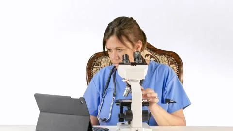 Doctor, Nurse, lab tech with microscope Stock Photos