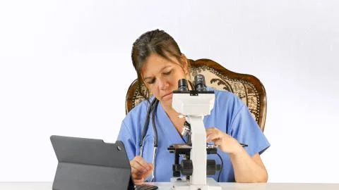 Doctor, Nurse, lab tech with microscope	 Stock Photos
