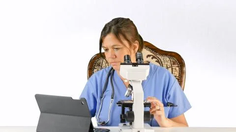Doctor, Nurse, lab tech with microscope Stock Photos