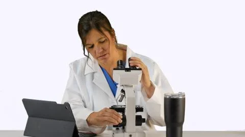 Doctor, Nurse, lab tech with microscope Foto stock