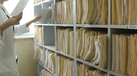 Doctor Nurse medical records at the clinic  Stock Footage