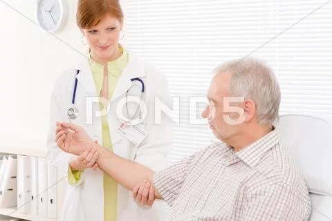 Doctor office - female physician examine patient Stock Photos