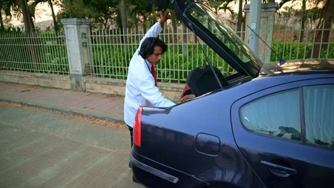 Doctor opening car boot Stock Footage 278023228