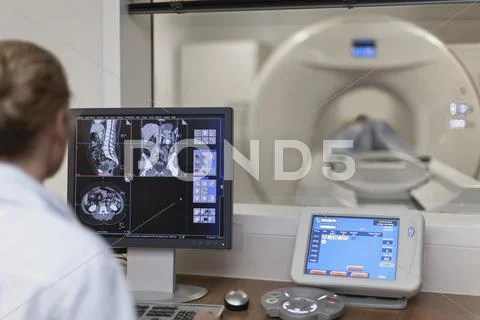 Doctor Operating Ct Scanner In Hospital
