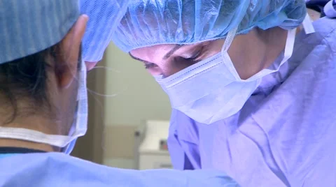 Doctor operating in operating room Stock Footage 43052655