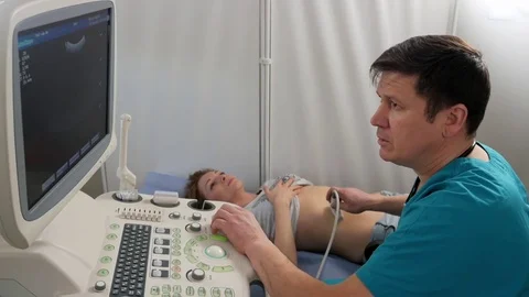 A doctor is operating ultrasonic test unit Stock Footage 72597056